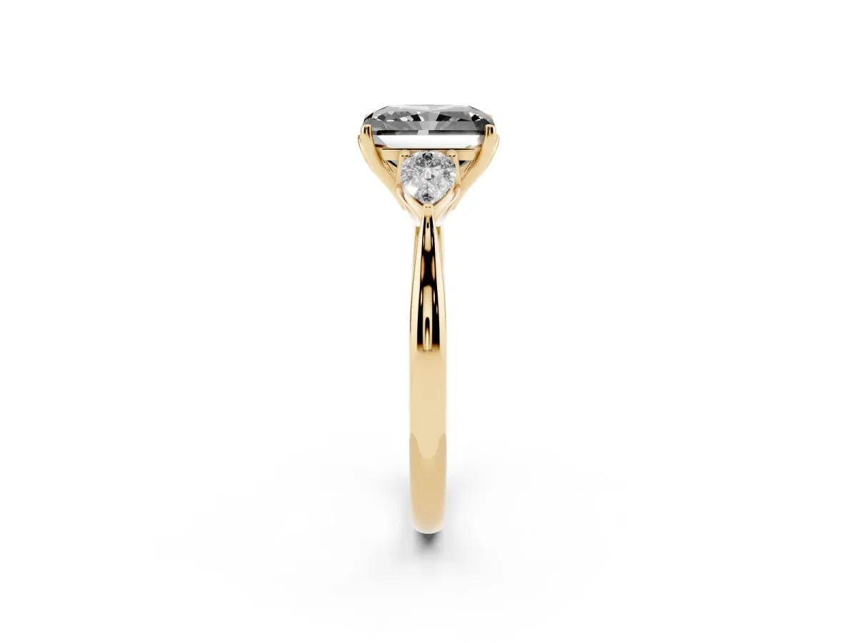 Fancy Black Radiant Cut Diamond Three-Stone Ring with Pear Side Stones and Prong Setting Yellow gold