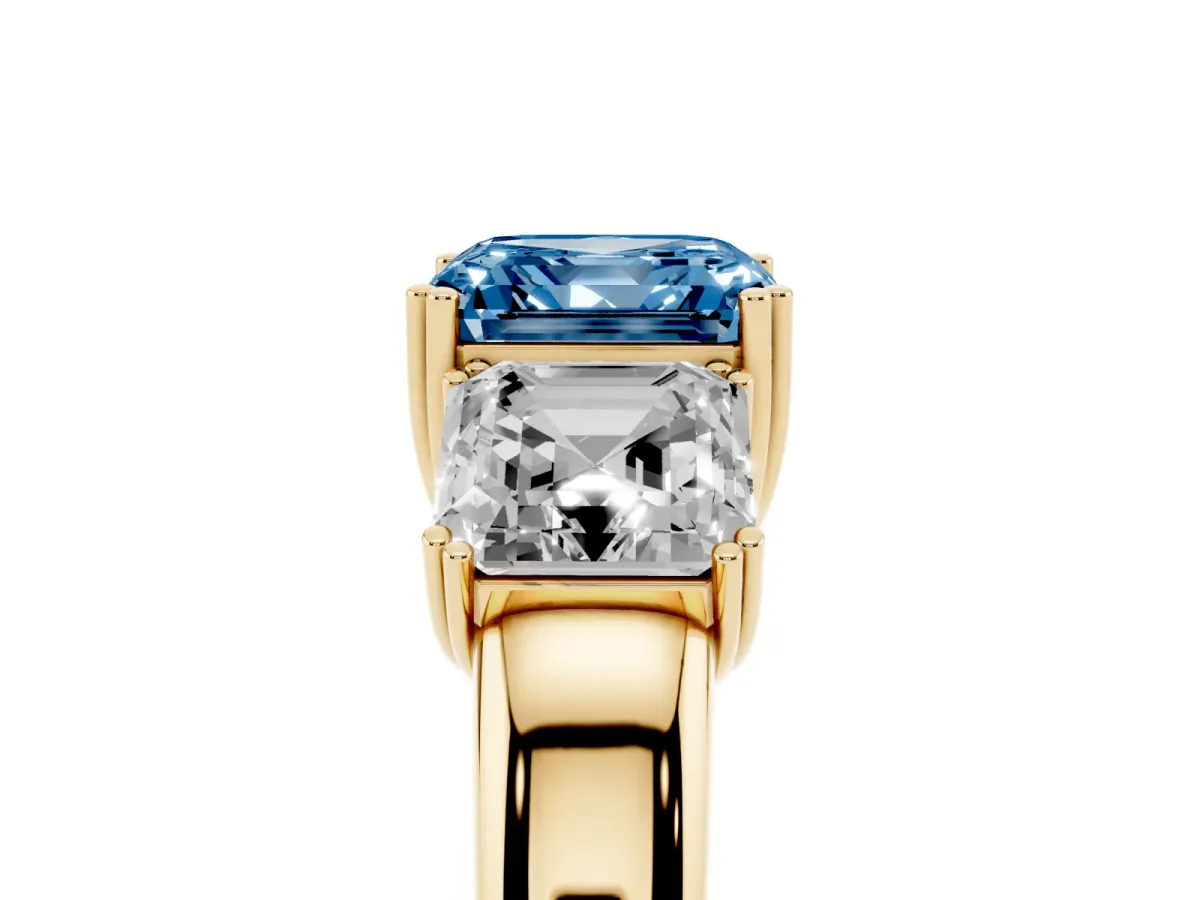 Fancy Blue Three-Stone Asscher Cut Cut Diamond Ring with Channel Set Band and Four-Prong Setting Yellow gold