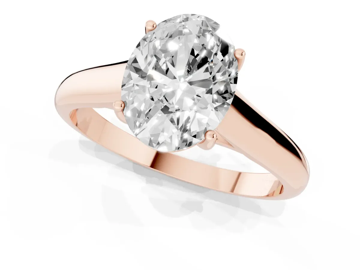 Oval Cut Solitaire Engagement Ring with Tapered Band and Four-Prong Setting Rose gold