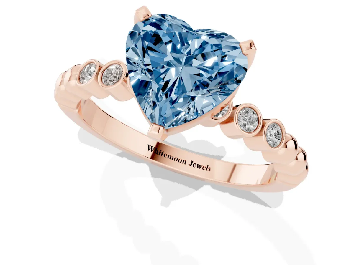 Fancy Blue Heart Cut Solitaire Bezel Accent Diamond Engagement Ring with Beaded Band and Four-Prong Setting Rose gold