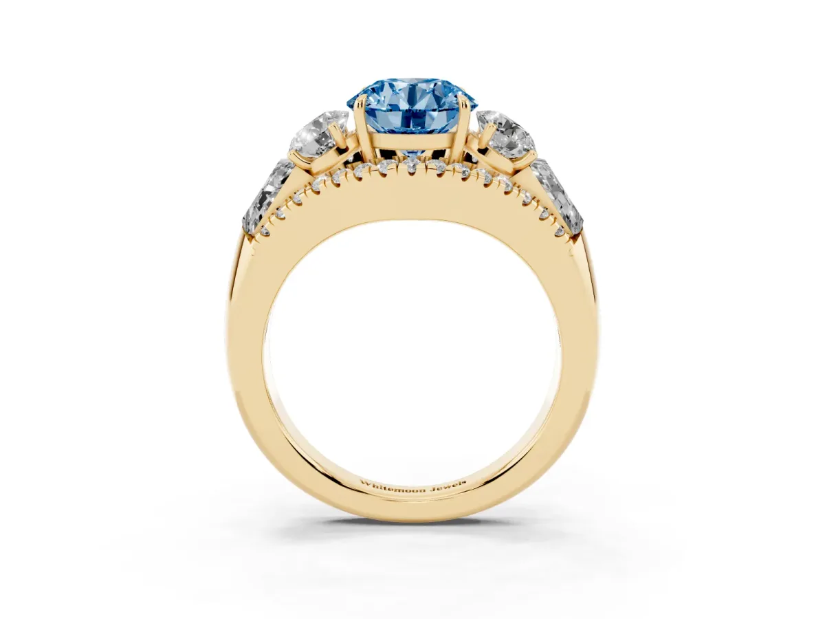 Fancy Blue Three-Stone Round Cut Diamond Engagement Ring with Pave Band and Prong Setting Yellow gold