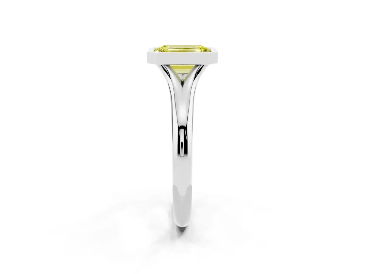 Fancy Yellow Bezel Set Emerald Cut Solitaire Diamond Ring with Smooth Band Silver