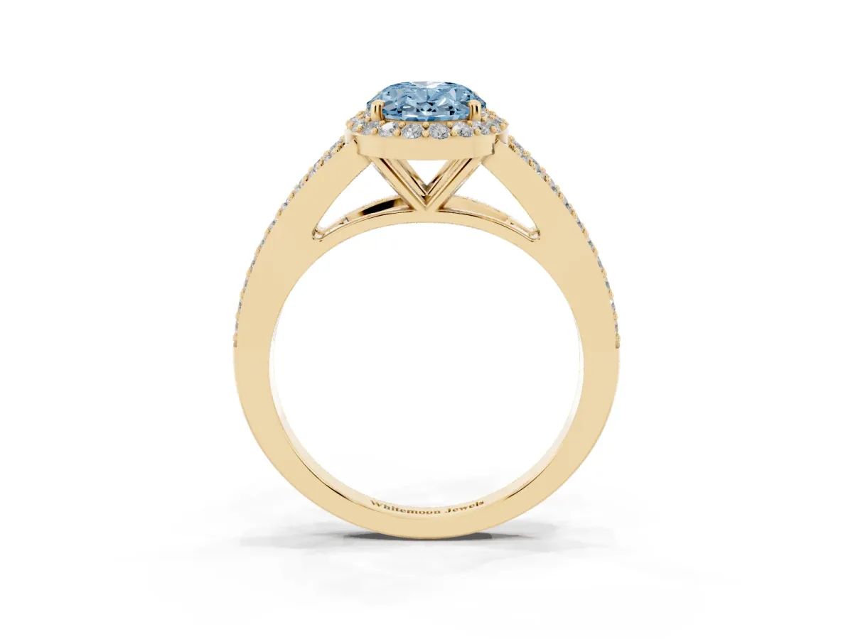 Fancy Blue Oval Cut Halo Split Shank Diamond Ring with Prong Setting Yellow gold