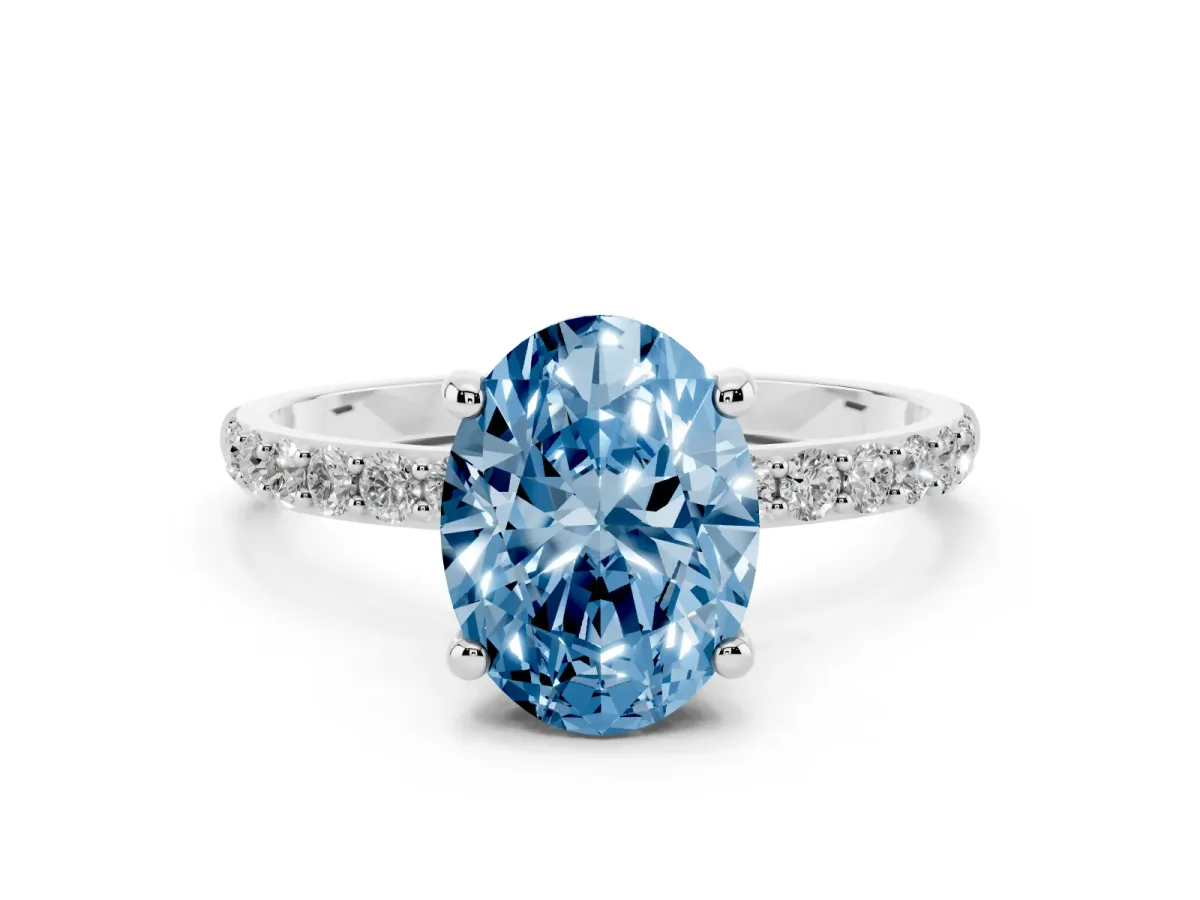 Fancy Blue Oval Cut Diamond Solitaire Ring with Round Pavé Band and Prong Setting Silver