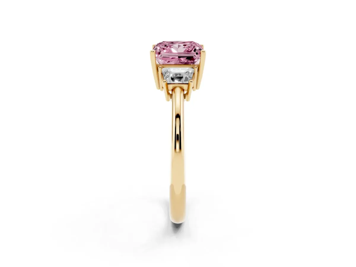 Fancy Pink Princess Cut Diamond Three-Stone Ring with Trapezoid Side Stones and Prong Setting Yellow gold