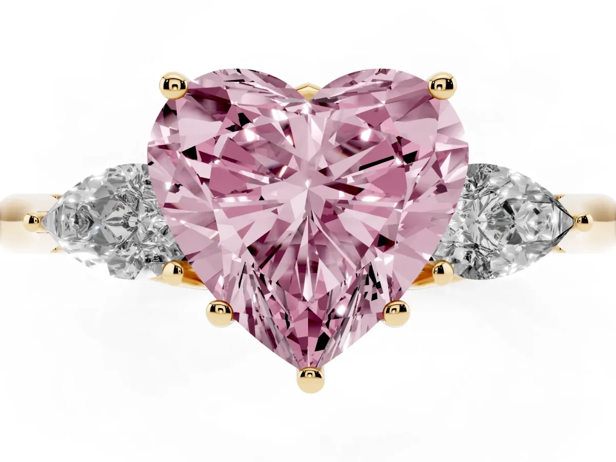 Fancy Pink Heart Cut Diamond Three-Stone Ring with Pear Side Stones and Prong Setting Yellow gold