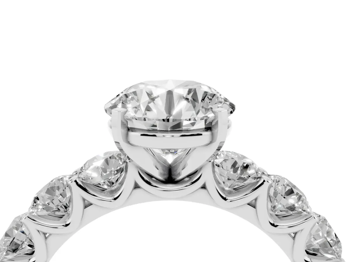 Round Cut Diamond Prong Setting with Side Stones on a Pave Band Silver