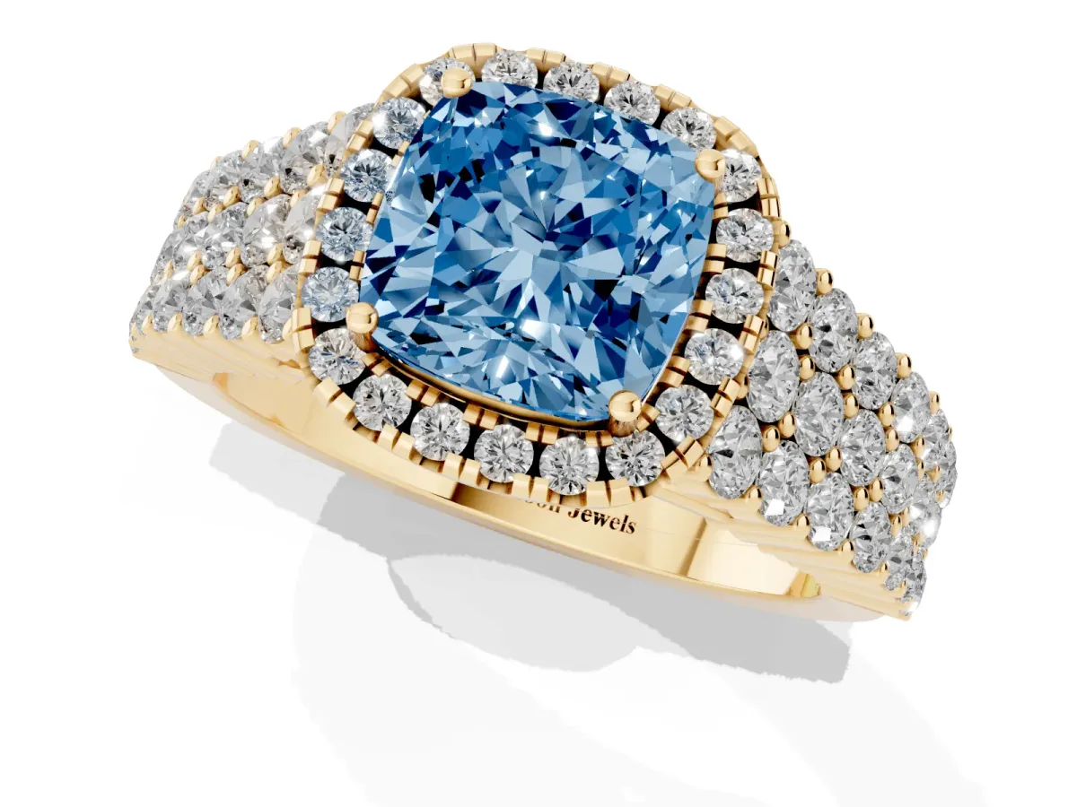 Fancy Blue Cushion Cut Diamond Halo Engagement Ring with Triple Row Round Pavé Band and Prong Setting Yellow gold