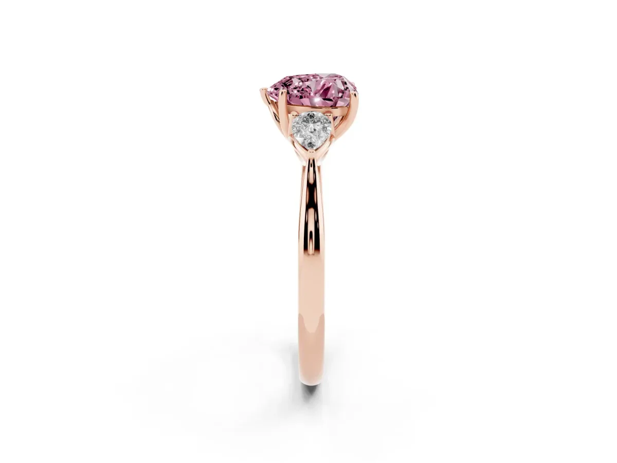 Fancy Pink Three-Stone Heart Cut Brilliant Diamond Solitaire Ring with Tapered Band and Four-Prong Setting Rose gold