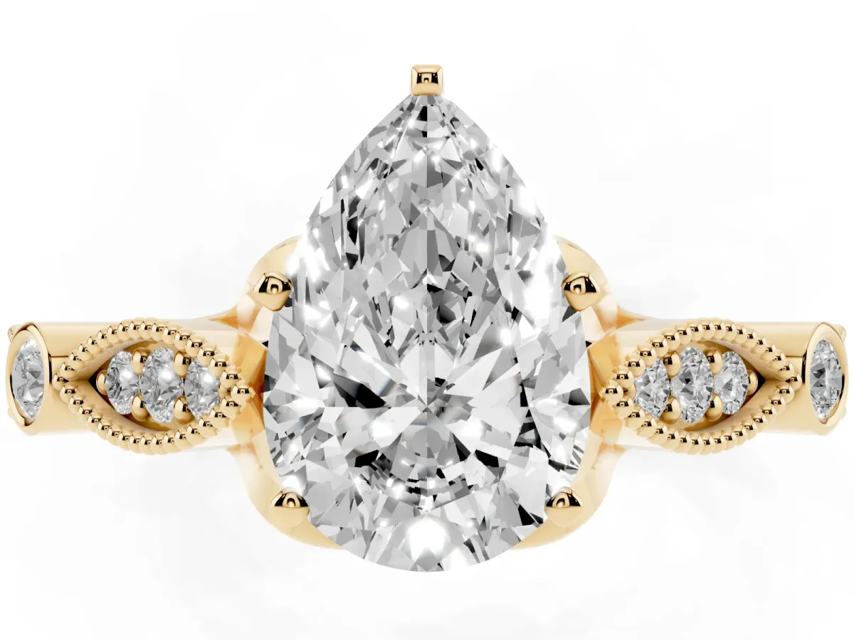 Pear Cut Cut Diamond with Milgrain Marquise and Bezel Accents on a Solitaire Band with Prong Setting Yellow gold