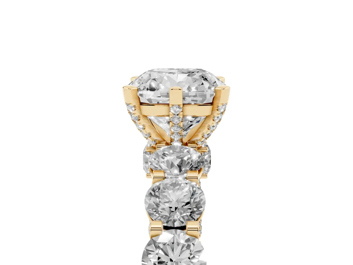 Cushion Cut Diamond Side Stone Engagement Ring with Four-Prong Setting Yellow gold