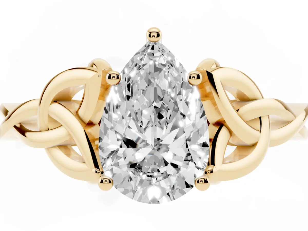 Pear Cut Diamond Solitaire Engagement Ring with Celtic Knot Band and Four-Prong Setting Yellow gold
