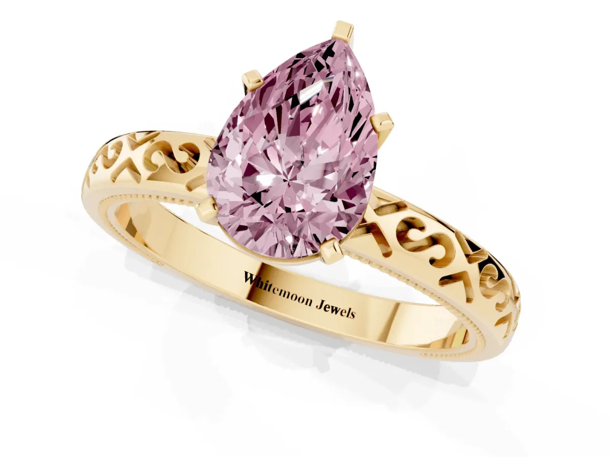 Fancy Pink Pear Cut Solitaire Engagement Ring with Scrollwork Band and Four-Prong Setting Yellow gold
