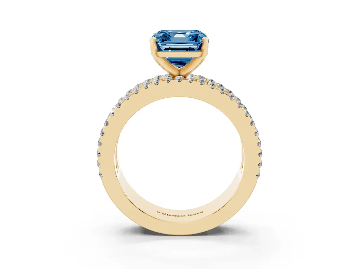 Fancy Blue Asscher Cut Diamond Solitaire Ring with Pavé and Channel Set Band Yellow gold