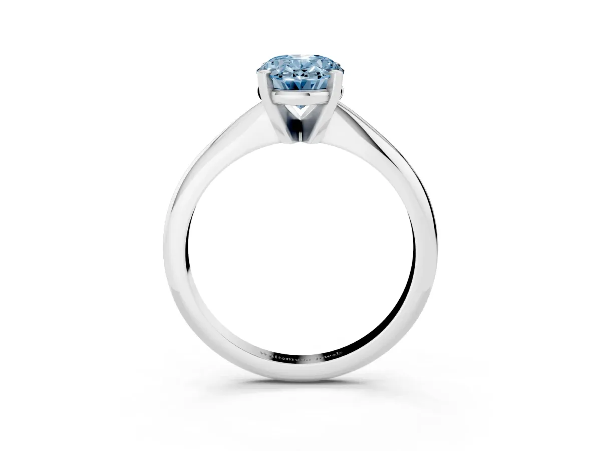 Fancy Blue Oval Cut Cut Solitaire Ring with Four-Prong Setting on a Classic Band Silver