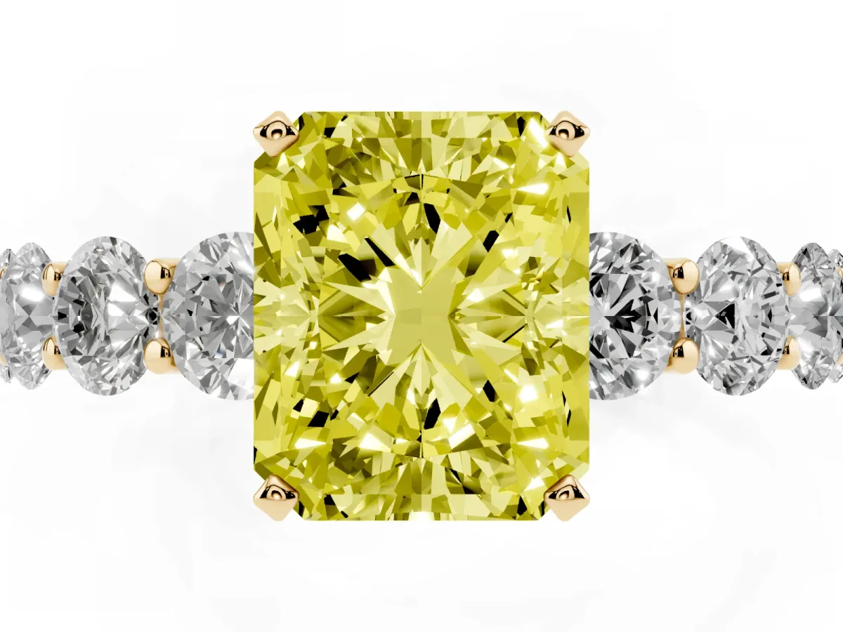 Fancy Yellow Radiant Cut Diamond Prong Setting with Side Stones on a Pave Band Yellow gold
