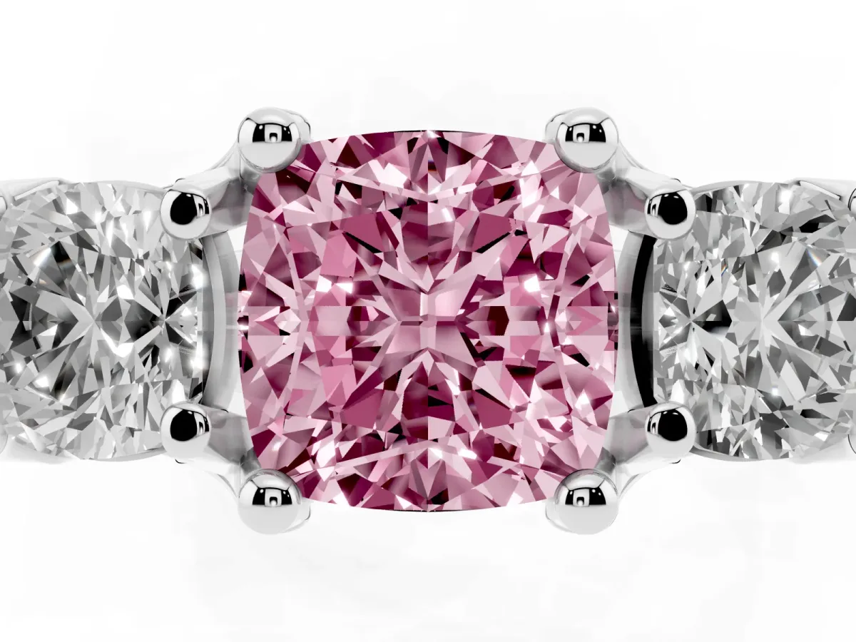 Fancy Pink Cushion Cut Diamond Three-Stone Ring with Channel Set Band and Four-Prong Setting Platinum