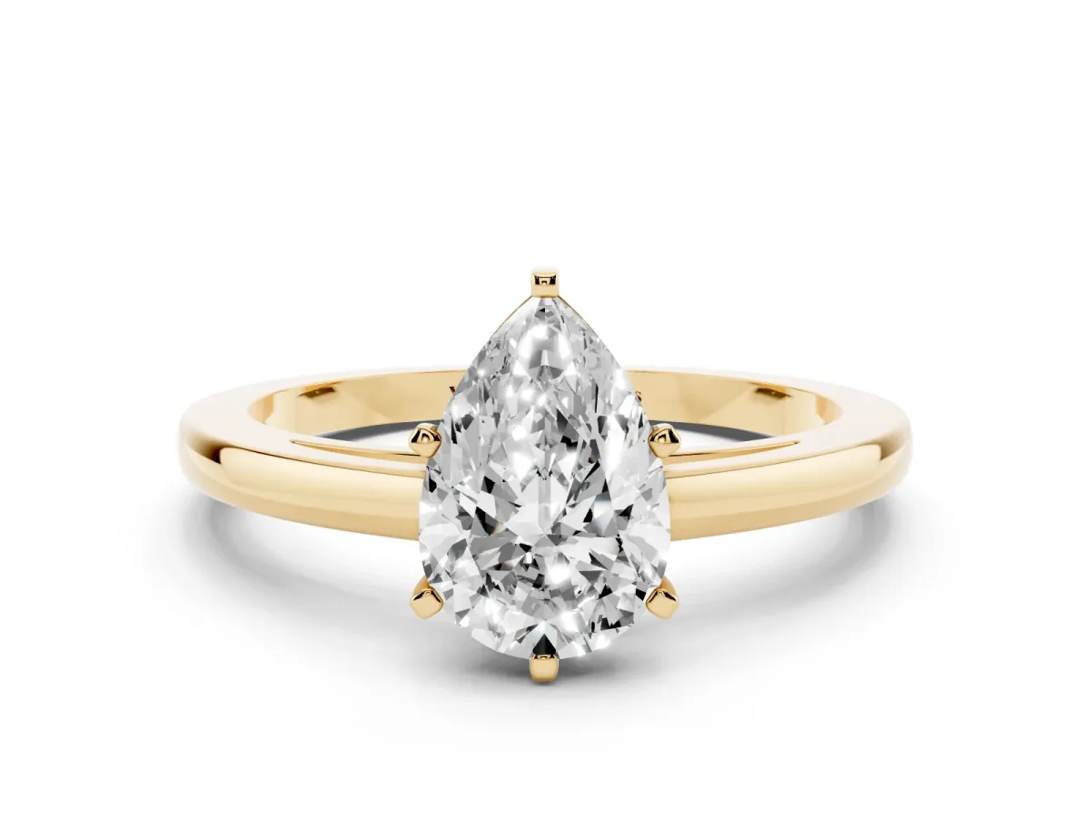 Pear Cut Solitaire Diamond Engagement Ring with Four-Prong Setting on a Classic Band Yellow gold