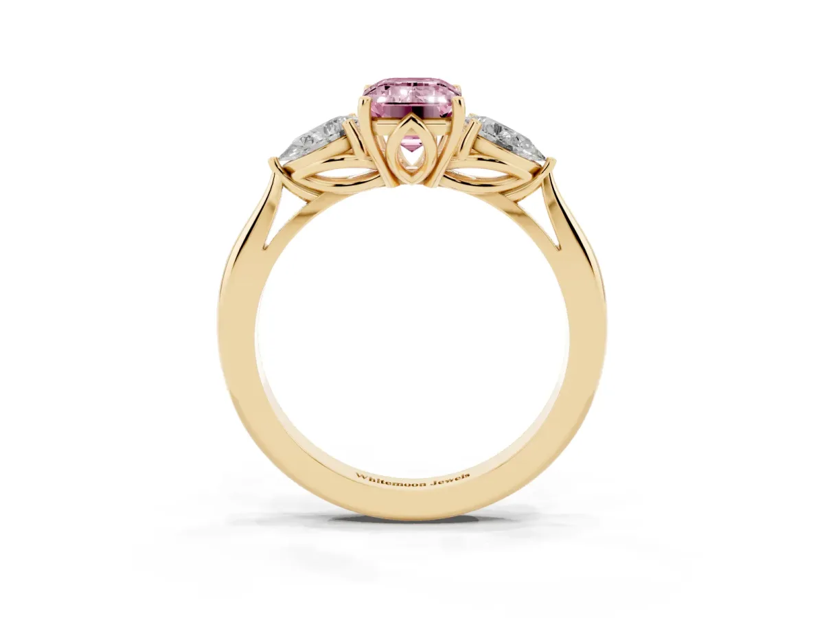 Fancy Pink Three-Stone Emerald Cut Diamond Ring with Pear Side Stones in Four-Prong Setting Yellow gold