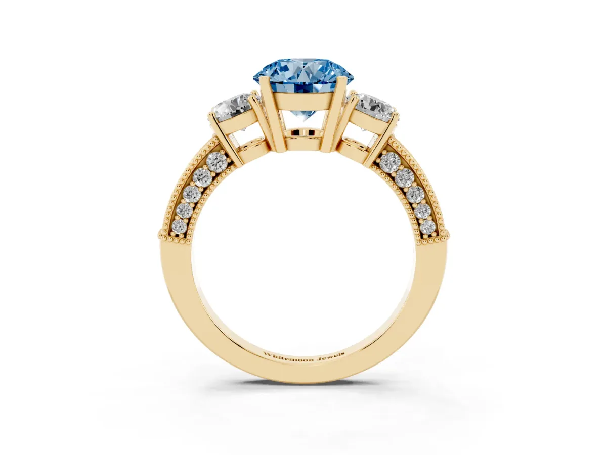Fancy Blue Round Cut Three-Stone Diamond Ring with Pavé Band and Four-Prong Setting Yellow gold