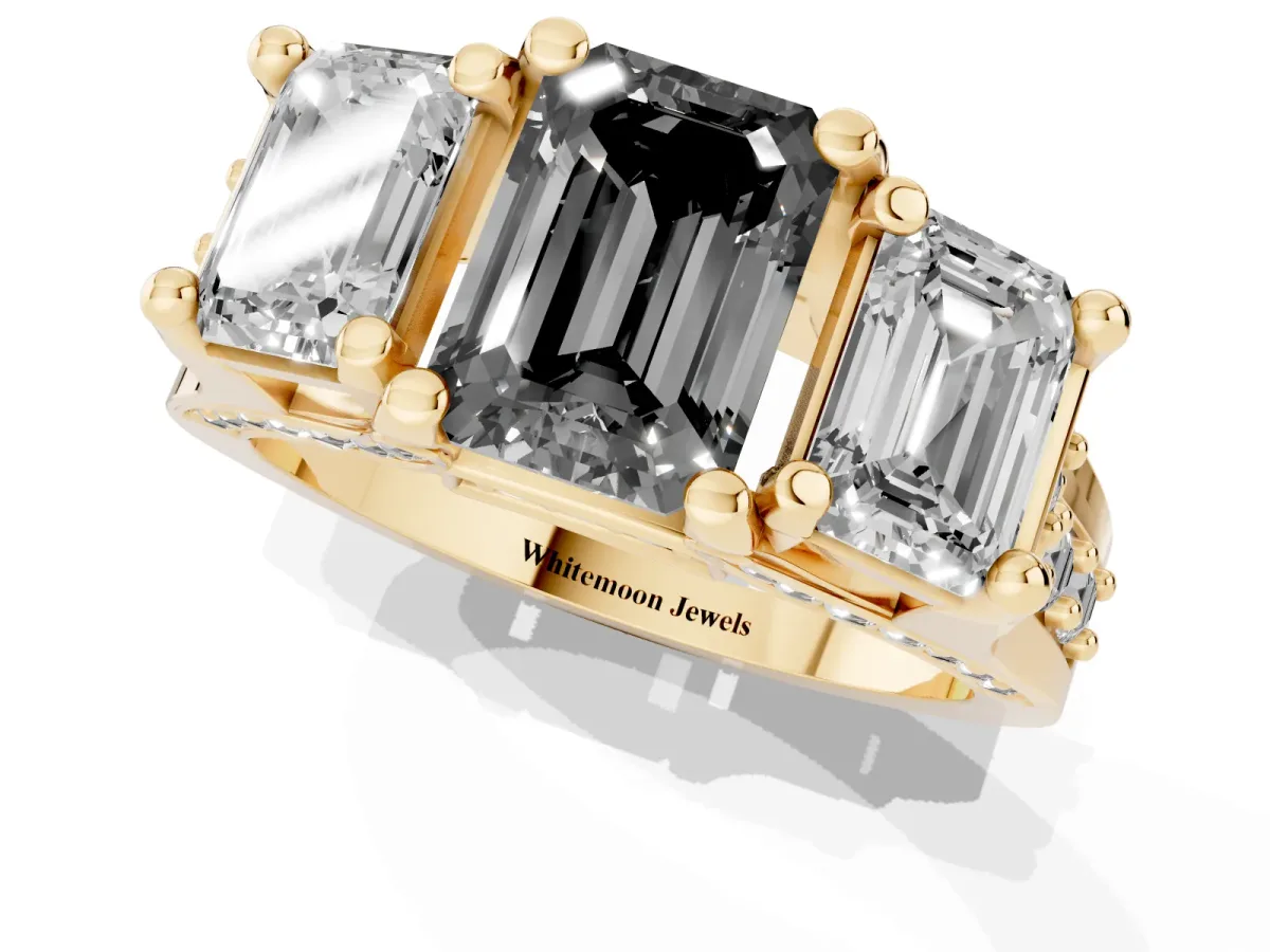 Fancy Black Emerald Cut Diamond Three-Stone Ring with Channel Set Band and Four-Prong Setting Yellow gold