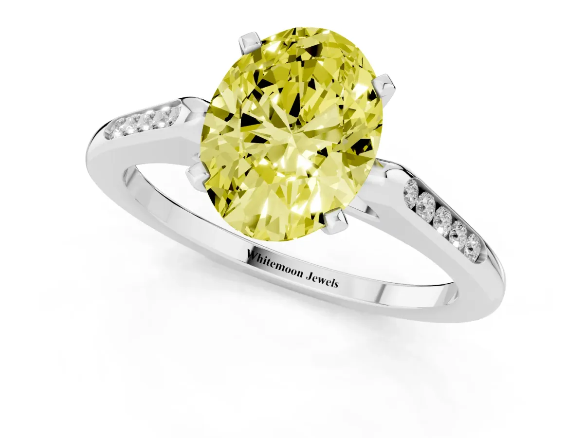 Fancy Yellow Oval Cut Diamond Solitaire Ring with Channel Set Round Band and Prong Setting Silver