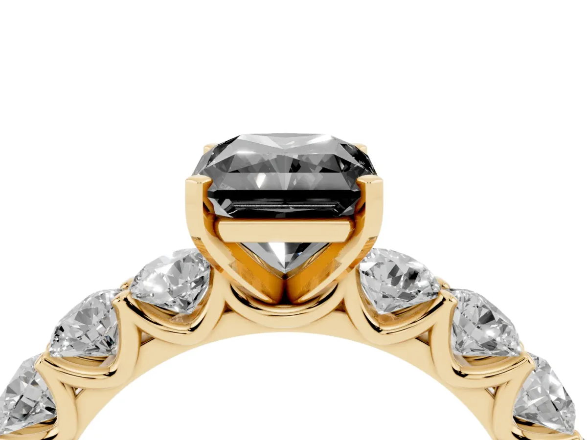 Fancy Black Radiant Cut Diamond Prong Setting with Side Stones on a Pave Band Yellow gold