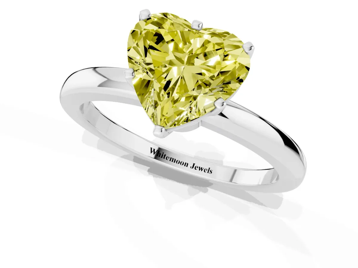 Fancy Yellow Heart Cut Solitaire Diamond Ring with Six-Prong Setting on a Classic Band Silver