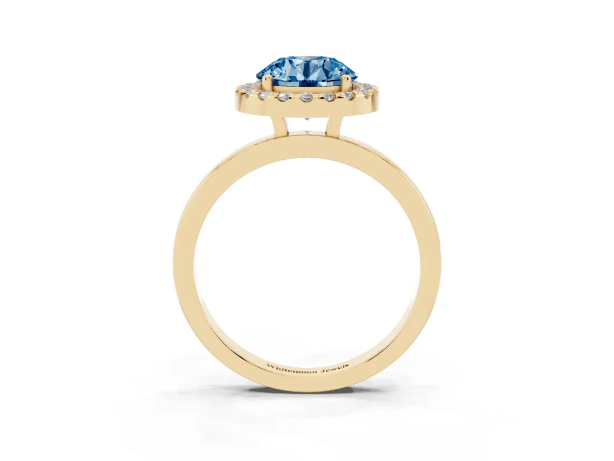 Fancy Blue Round Cut Halo Diamond Solitaire with Pavé Band and Four-Prong Setting Yellow gold