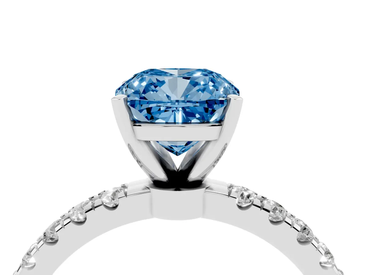 Fancy Blue Cushion Cut Diamond Solitaire Ring with Pavé Accents and Four-Prong Setting Silver