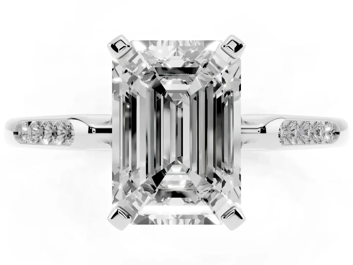 Emerald Cut Diamond Solitaire Ring with Channel Set Round Band and Prong Setting White gold