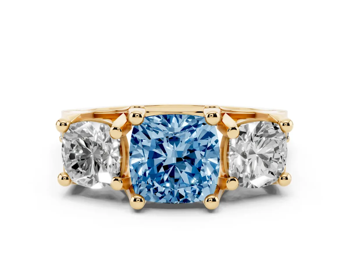 Fancy Blue Cushion Cut Diamond Three-Stone Ring with Channel Set Band and Four-Prong Setting Yellow gold