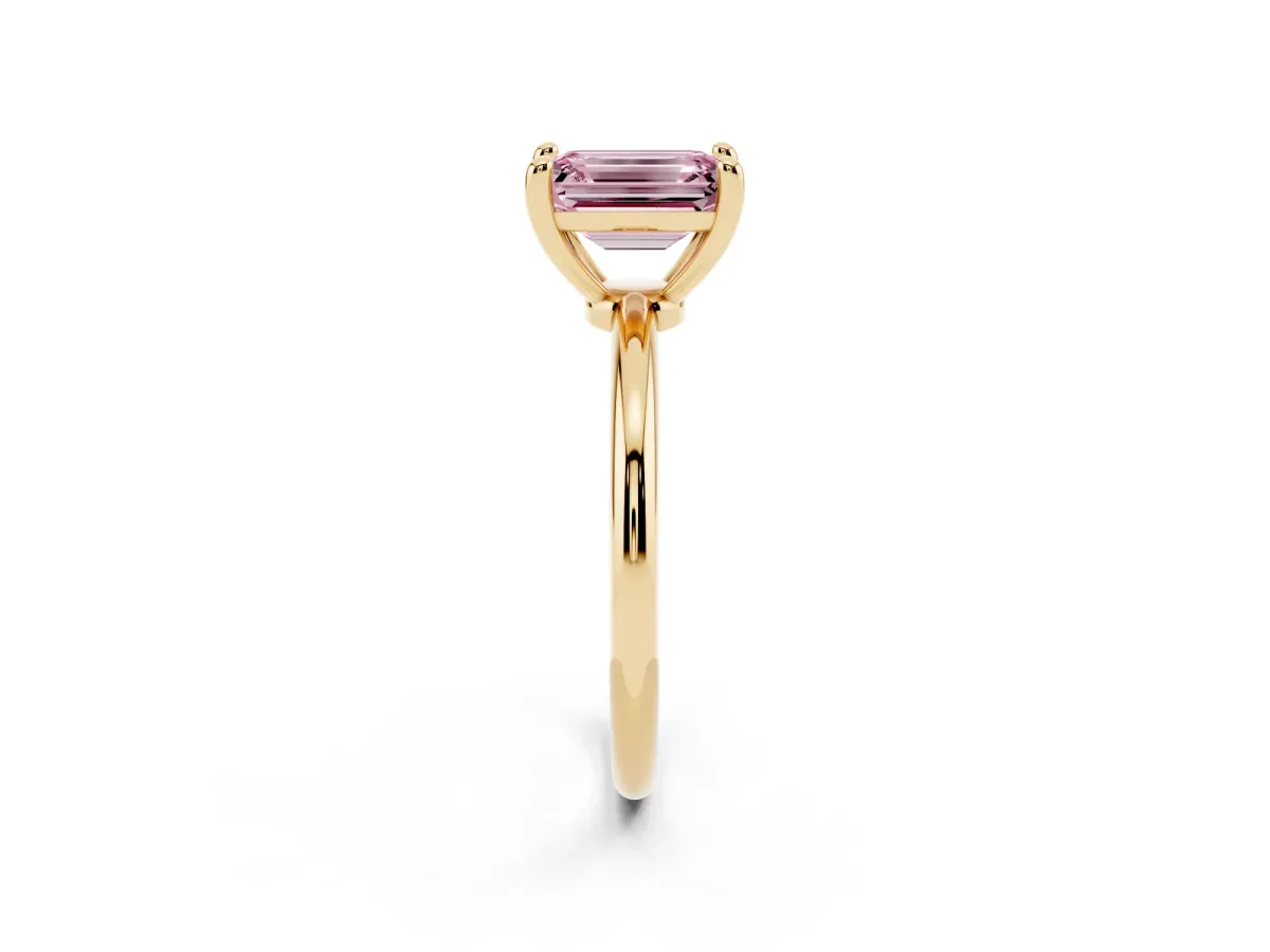 Fancy Pink Emerald Cut Solitaire Diamond Ring with 4-Prong Setting on a Classic Band Yellow gold