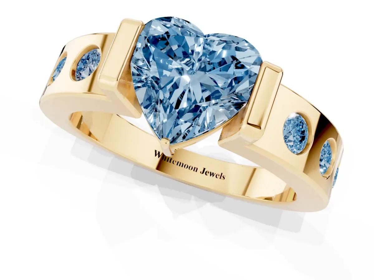 Fancy Blue Heart Cut Brilliant Channel-Set Diamond Ring with Bezel Prong Setting Yellow gold