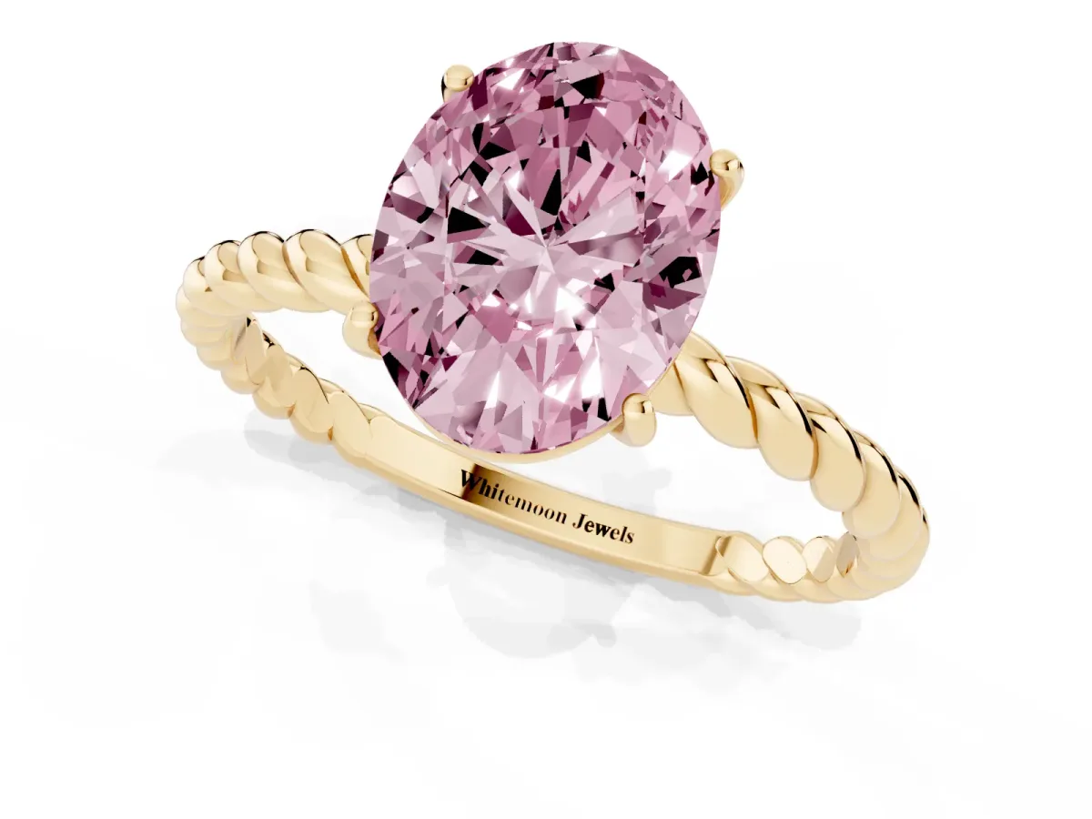 Fancy Pink Oval Cut Solitaire Twist Band Ring with Four-Prong Setting Yellow gold