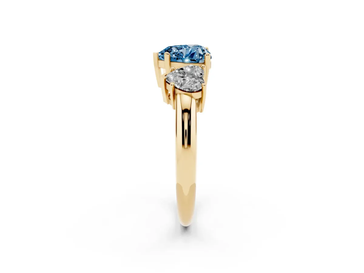 Fancy Blue Three-Stone Heart Cut Cut Diamond Engagement Ring with Prong Setting on a White Gold Band Yellow gold