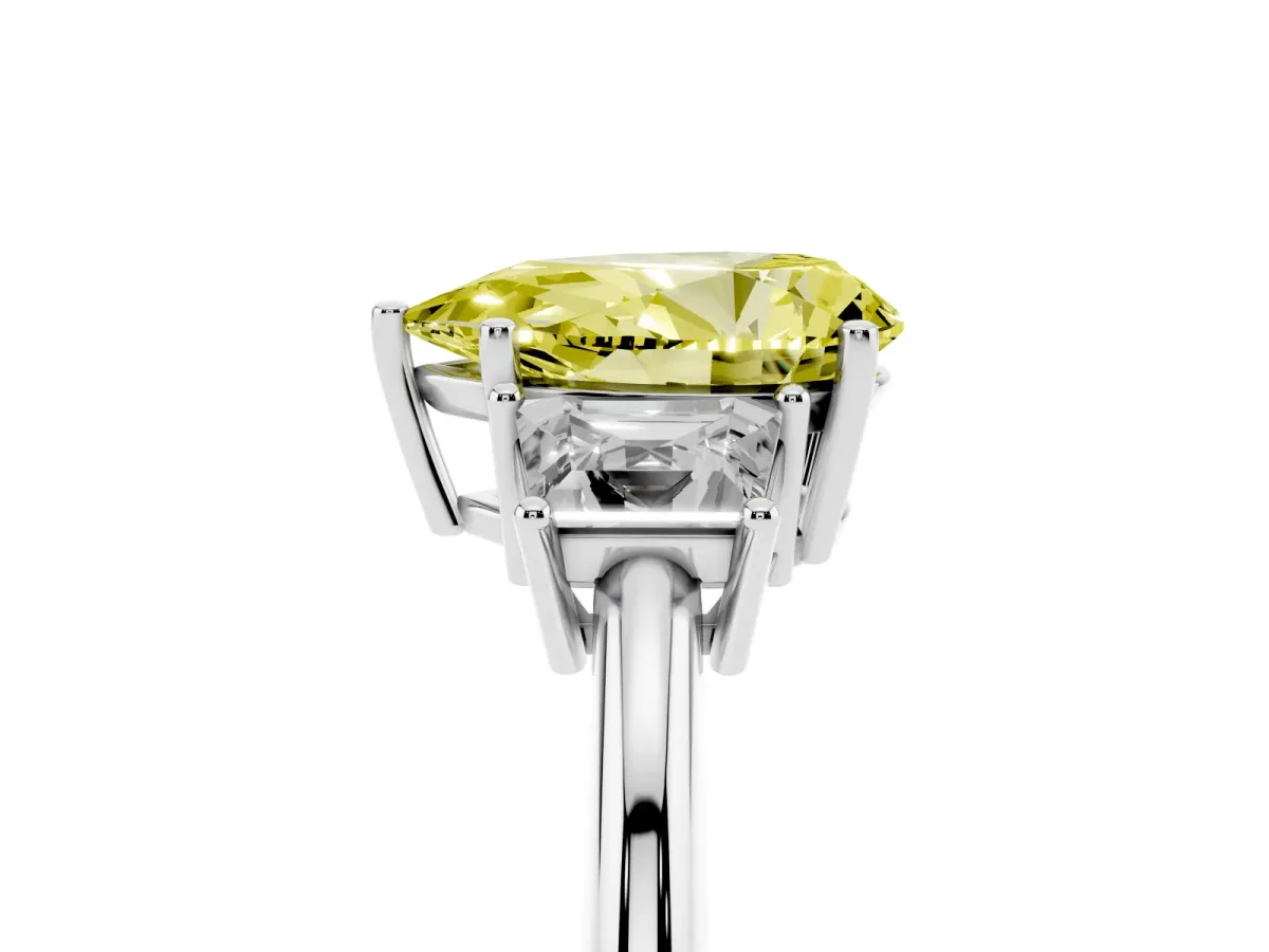 Fancy Yellow Pear Cut Diamond Three-Stone Ring with Trapezoid Side Stones and Prong Setting Platinum
