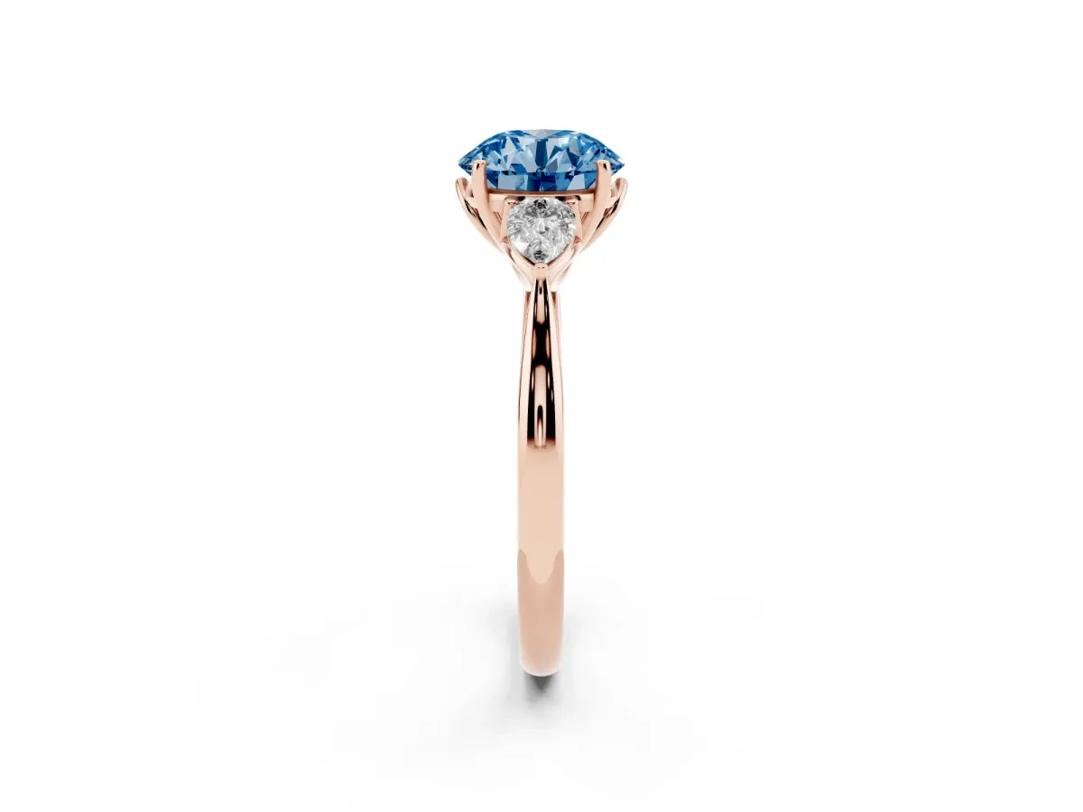 Fancy Blue Three-Stone Round Cut Brilliant Diamond Solitaire Ring with Tapered Band and Four-Prong Setting Rose gold