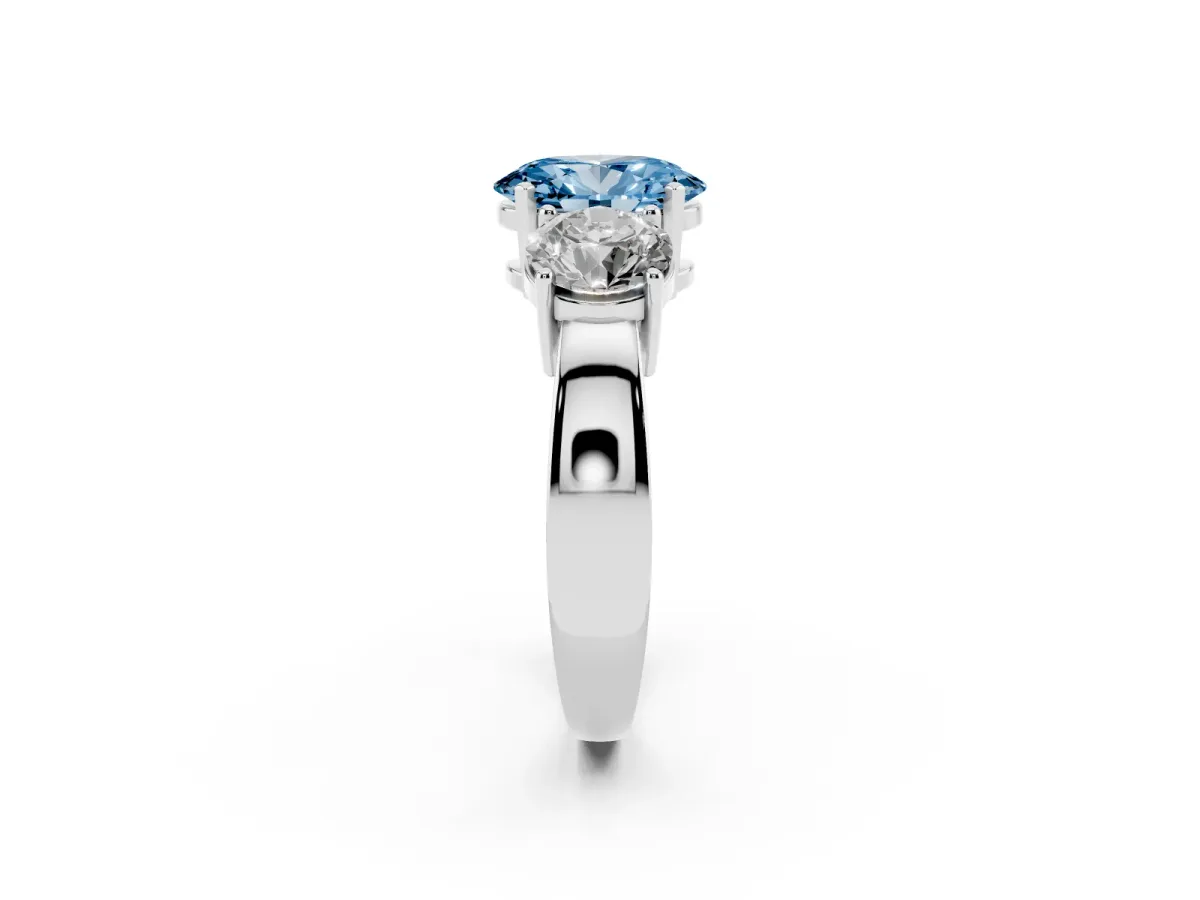 Fancy Blue Three-Stone Oval Cut Diamond Ring with Round Side Stones, Classic Band, and Four-Prong Setting White gold