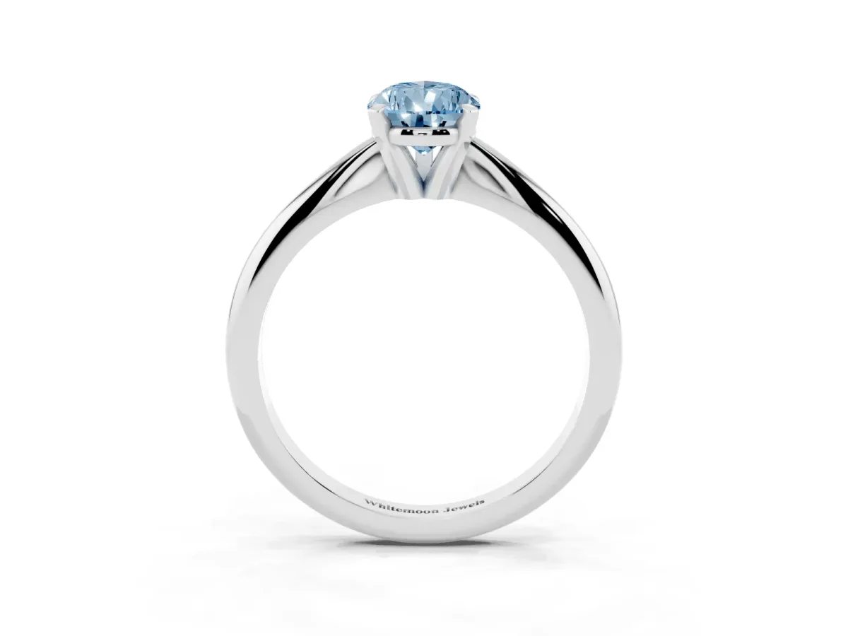 Fancy Blue Pear Cut Cut Solitaire Ring with Four-Prong Setting on a Classic Band Silver