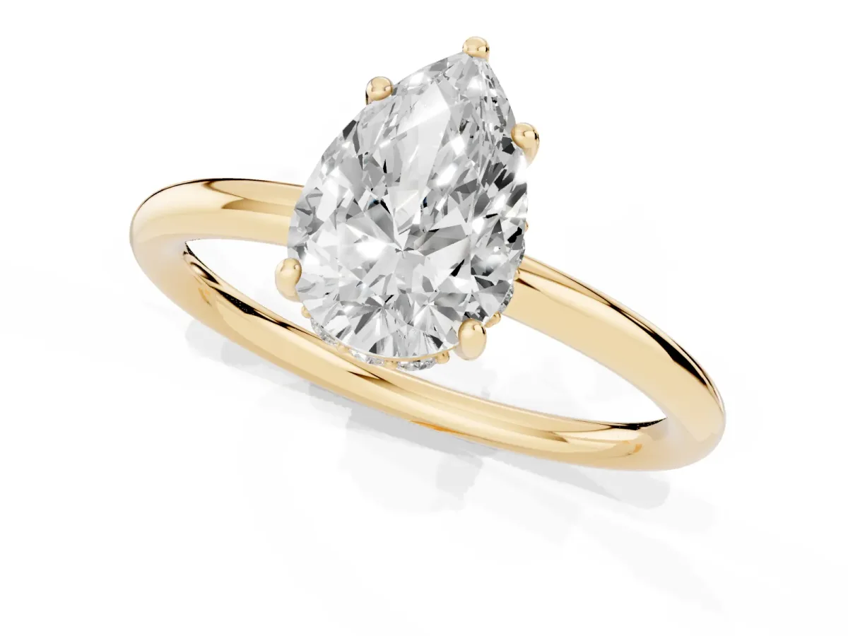 Pear Cut Solitaire Diamond Ring with a Classic Band and Four-Prong Setting Yellow gold