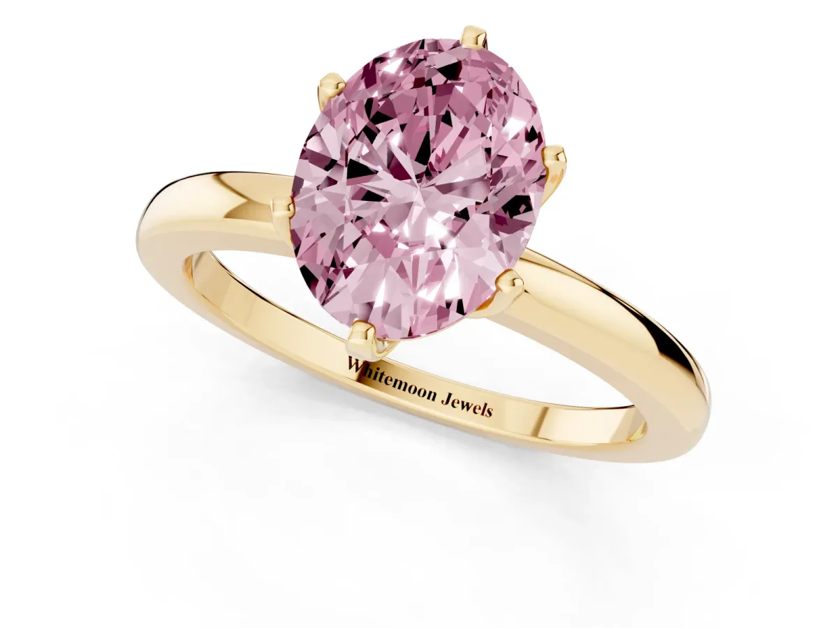 Fancy Pink Oval Cut Solitaire Diamond Ring with Six-Prong Setting on a Classic Band Yellow gold