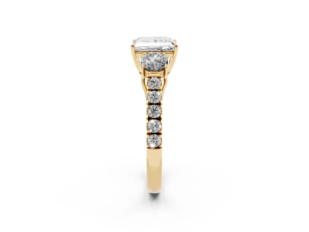 Princess Cut Cut Diamond Three-Stone Ring with Round Side Stones and Pavé Band Yellow gold