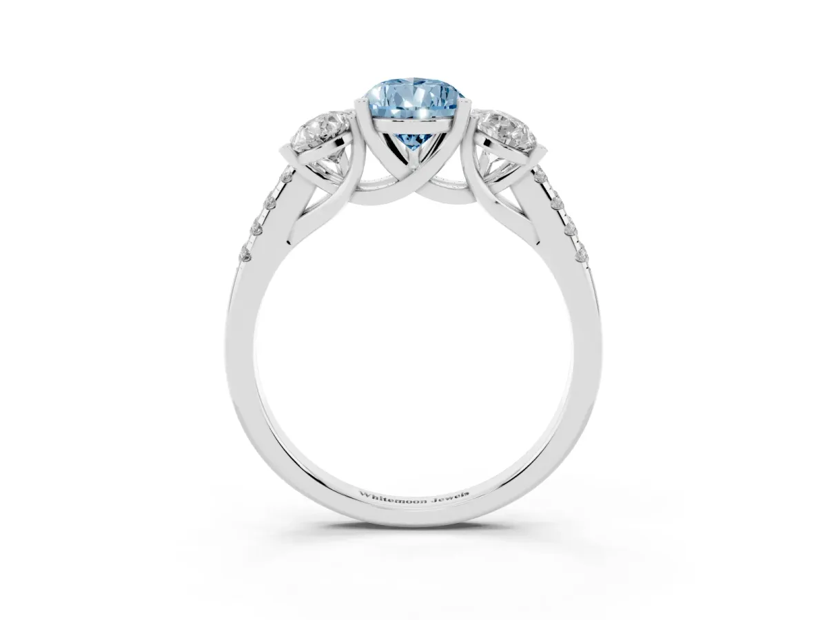 Fancy Blue Three-Stone Pear Cut Diamond Ring with Round Pavé Band and Prong Setting Silver
