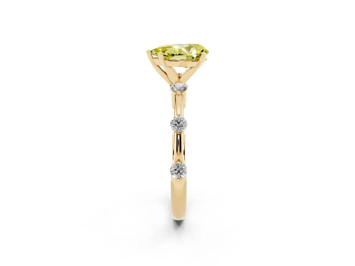 Fancy Yellow Pear Cut Solitaire Diamond Ring with Bezel Set Side Stones and Prong Setting Yellow gold