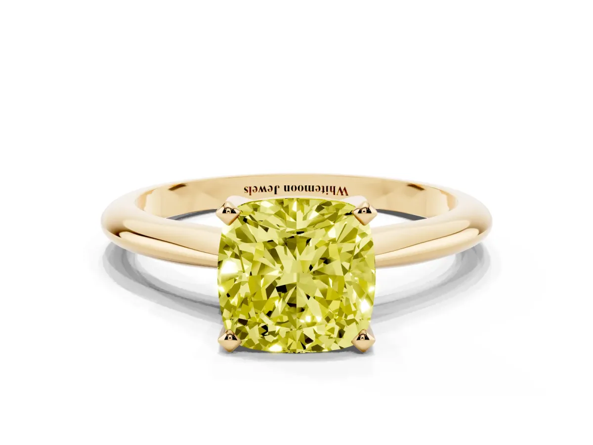 Fancy Yellow Cushion Cut Cut Solitaire Ring with Four-Prong Setting on a Classic Band Yellow gold