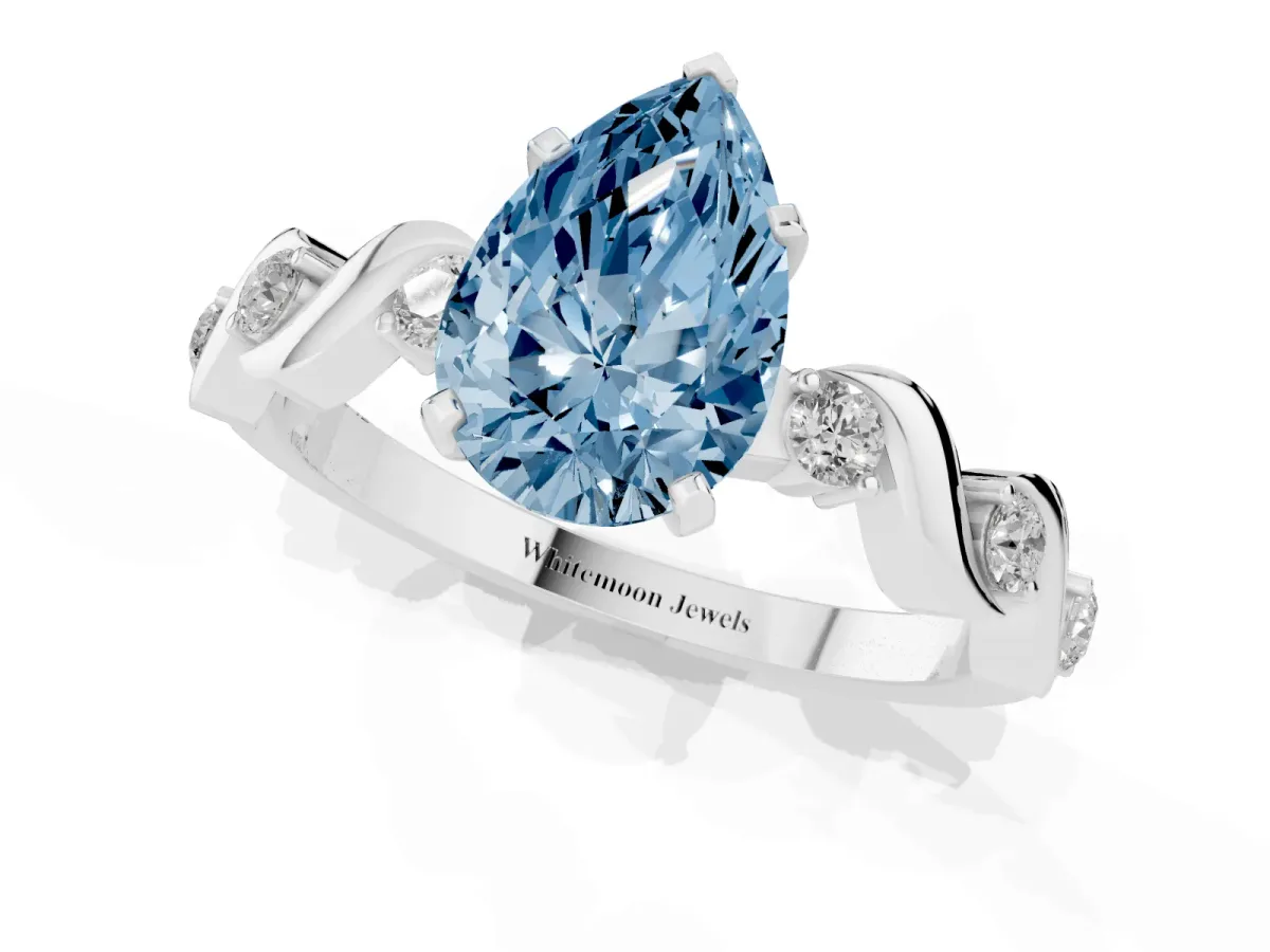 Fancy Blue Pear Cut Diamond Solitaire Twisted Band with Round Accents and Prong Setting Platinum