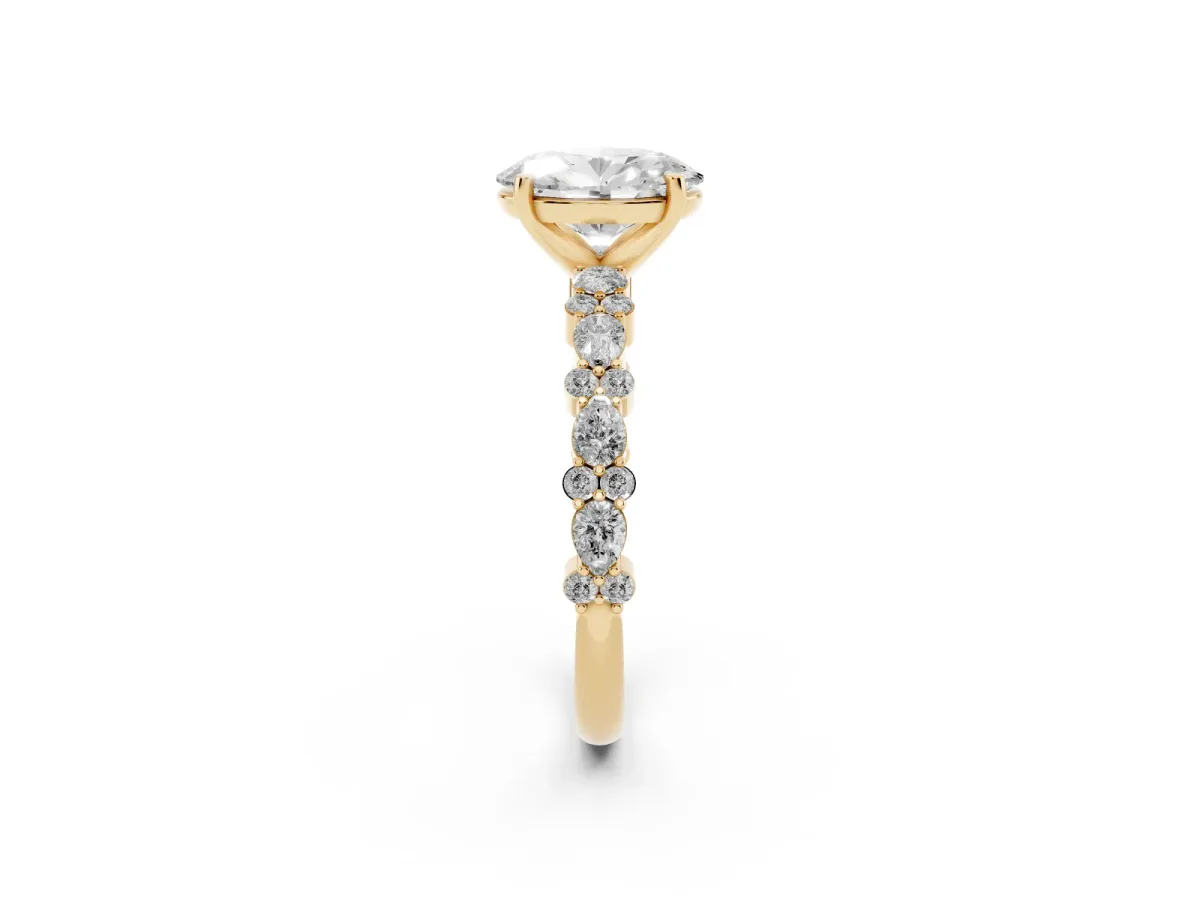Oval Cut Diamond Side Stone Solitaire Ring with Round and Four-Prong Setting Yellow gold