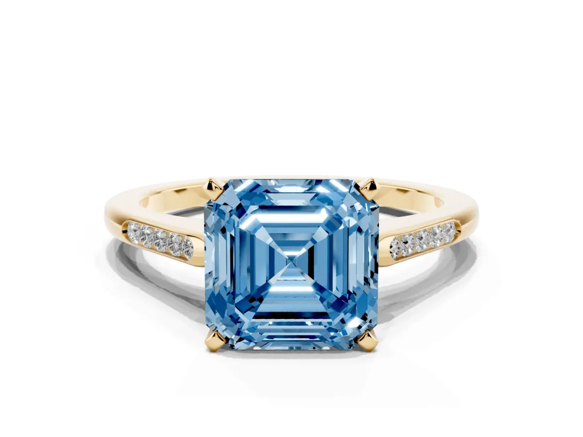 Fancy Blue Asscher Cut Diamond Solitaire Ring with Channel Set Round Band and Prong Setting Yellow gold
