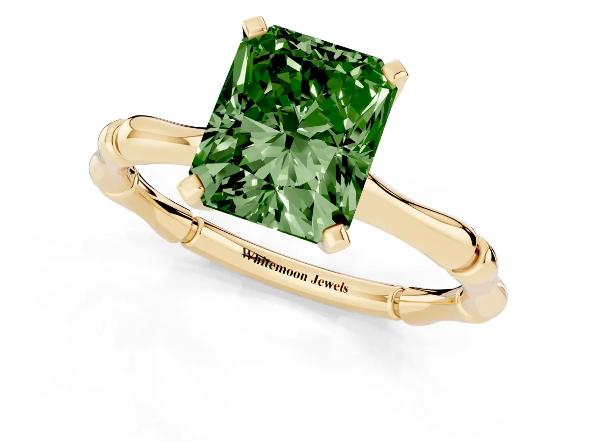 Fancy Green Radiant Cut Solitaire Diamond Ring with Bamboo Band and Four-Prong Setting Yellow gold
